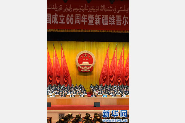 10月1日，慶祝中華人民共和國成立66周年暨新疆維吾爾自治區(qū)成立60周年大會在新疆人民會堂隆重舉行。 新華社記者 高潔 攝 
